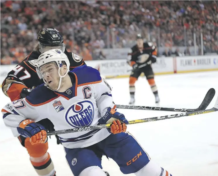  ?? SEAN M. HAFFEY/GETTY IMAGES ?? Captain Connor McDavid and the Edmonton Oilers were chopped down by Hampus Lindholm and the Anaheim Ducks in Game 7 as the Ducks captured a 2-1 victory on home ice Wednesday at the Honda Center to win the best-of-seven series and earn a date with the Nashville Predators in the Western Conference Final.