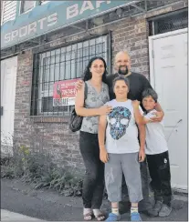  ?? KENN OLIVER/THE TELEGRAM ?? Eldin Husic (right) and his wife Adnela Halebic-husic, shown here with their sons Mehmed-mesha, left, and Tarik, are hopeful that St. John’s city council will vote to extend the non-conforming use expiration date on commercial properties in residentia­l...