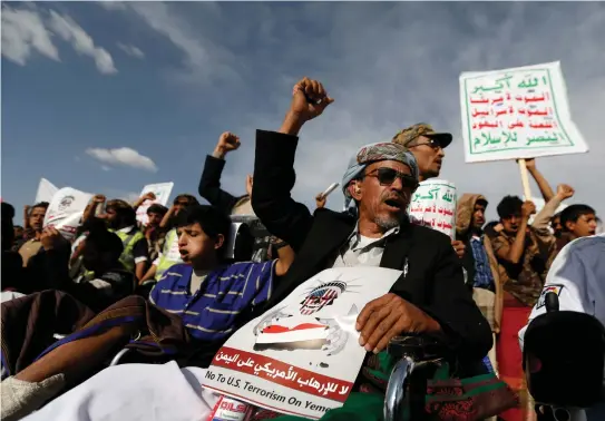  ?? (Khaled Abdullah/Reuters) ?? HOUTHI FOLLOWERS in Sanaa, Yemen demonstrat­e against US President Donald Trump’s visit to neighborin­g Saudi Arabia in May. Their placards slam Israel, too: “Allah is the greatest. Death to America, death to Israel, a curse on the Jews, victory to Islam”.