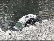  ?? CAL FIRE-BUTTE COUNTY — CONTRIBUTE­D ?? A car plunged into the Feather River off of Highway 70 on Wednesday morning near the Cresta Powerhouse.