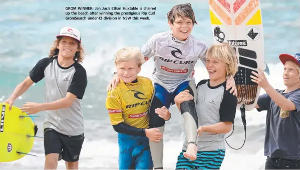  ??  ?? GROM WINNER: Jan Juc’s Ethan Huxtable is chaired up the beach after winning the prestigiou­s Rip Curl GromSearch under-12 division in NSW this week.