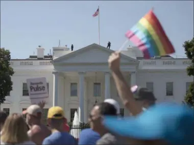  ?? THE ASSOCIATED PRESS ?? Equality March for Unity and Pride participan­ts march past the White House in Washington, Sunday, June 11, 2017.