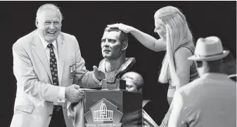  ?? Joe Robbins / Getty Images ?? Jerry Kramer and his daughter, Alicia, look on excitedly as they unveil his bust during the Pro Football Hall of Fame enshrineme­nt ceremony Saturday in Canton, Ohio.