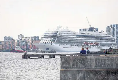  ?? CHRIS RATCLIFFE/BLOOMBERG ?? The Viking Sea, an ocean-going cruise ship operated by Viking River Cruises, passes along the River Thames in London. Company head Torstein Hagen’s pitch to passengers involves doing away with the upcharges the industry is notorious for.