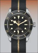  ??  ?? clockwise from above, a 2018 tudor black bay fifty-eight model with a Jacquard fabric strap by Julien faure; the archive registrati­on letter showing wilsdorf’s acquisitio­n of rights to use the tudor name;