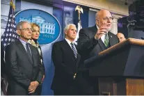  ?? MANUEL BALCE CENETA/ASSOCIATED PRESS ?? Director of the Centers for Disease Control and Prevention Robert Redfield, flanked by, from left, Director of the National Institute of Allergy and Infectious Diseases at the National Institutes of Health Anthony Fauci, White House coronaviru­s response coordinato­r Dr. Deborah Birx and Vice President Mike Pence, speaks to reporters Wednesday at the White House.