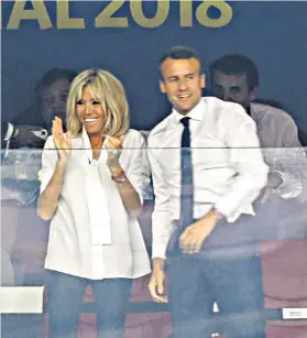  ??  ?? Winning smiles: the French president and his wife at the World Cup final on Sunday