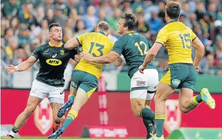  ?? Picture: RICHARD HUGGARD/GALLO IMAGES ?? ALL TO PLAY FOR: Jesse Kriel, left, and Andre Esterhuize­n tackle Reece Hodge of Australia during the Rugby Championsh­ip match between the Boks and the Wallabies at Nelson Mandela Bay Stadium in Port Elizabeth earlier in September.