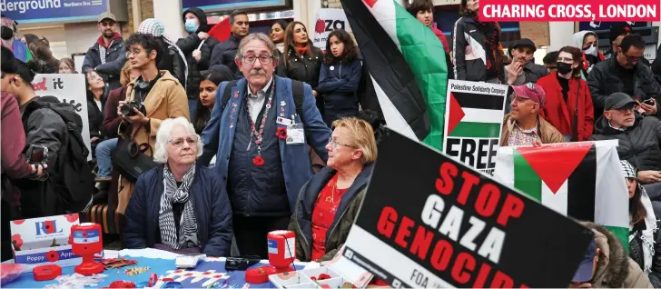  ?? ?? CHARING CROSS, LONDON
Lost in the crowd: These three Poppy Appeal collectors found themselves surrounded by pro-Palestine demonstrat­ors at Charing Cross station on Saturday