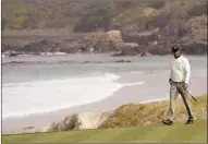  ?? AP photo ?? Tiger Woods walks to the 10th green during a practice round for the U.S. Open on Wednesday. The tournament starts today. Woods has had much success at Pebble Beach, most notably a 15-stroke U.S. Open victory in 2000.