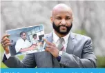  ?? ?? CELLE, Germany: Baba Hydara, son of the late Deyda Hydara, poses with a photo of his father on the sidelines of the trial against Gambian defendant Bai L., accused of crimes against humanity, murder and attempted murder. —AFP