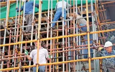  ??  ?? File picture of a constructi­on site in Colombo with mostly Chinese workers