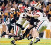  ?? DYLAN BUELL/GETTY ?? Georgia’s defense once again answered the bell in a victory on Saturday against an explosive Tennessee offense.