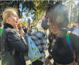  ?? Mel Melcon Los Angeles Times ?? A STANDOFF on New Year’s Eve at Echo Park Lake over some people refusing to wear a mask. L.A. wants to crack down on those who f lout the mask mandate.