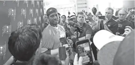  ??  ?? Buccaneers quarterbac­k Jameis Winston (3) talks with media on the first day of training camp. KIM KLEMENT/USA TODAY SPORTS