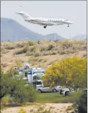  ?? Ross D. Franklin ?? The Associated Press Authoritie­s park Tuesday on a golf course near the site of a plane crash that killed six people in Scottsdale, Ariz.