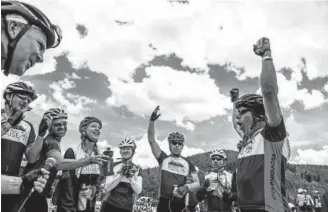  ??  ?? Team Samaritan House riders sing “Happy Birthday” to Roger Adams on Friday, the final day of the 33rd annual Ride the Rockies. The team has 58 riders.