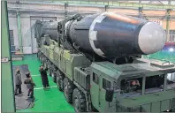  ?? AP PHOTO ?? This image provided by the North Korean government Thursday, shows North Korean leader Kim Jong Un and what the North Korean government calls the Hwasong-15 interconti­nental ballistic missile in North Korea.