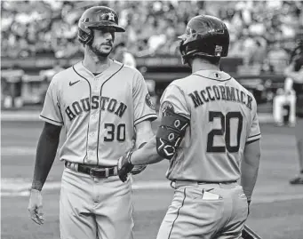  ?? Christophe­r Pasatieri/Getty Images ?? Chas McCormick, who never left New York between being optioned to Sugar Land on Sunday and being recalled two days later, congratula­tes Kyle Tucker on his first-inning homer Tuesday.