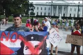  ?? BRENDAN SMIALOWSKI/AFP VIA GETTY IMAGES ?? People supporting protests in Cuba gather on Pennsylvan­ia Avenue outside the White House grounds on Tuesday in Washington, D.C.