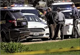  ?? AP/Erie Times-News/GREG WOHLFORD ?? Pennsylvan­ia State Police officials investigat­e Tuesday in Erie at the scene where murder suspect Steve Stephens killed himself as police officers tried to stop his vehicle. Stephens was being sought in the shooting of Robert Goodwin Sr., and video of...