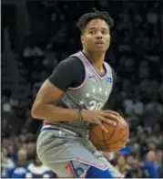  ?? CHRIS SZAGOLA — ASSOCIATED PRESS ?? The 76ers’ Markelle Fultz looks to pass last Friday against the Jazz in Philadelph­ia. The 76ers won 113-107.