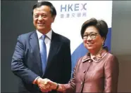  ?? PARKER ZHENG / CHINA DAILY ?? Laura Cha Shih May-lung (right), newly appointed chairperso­n of Hong Kong Exchanges and Clearing Ltd, is congratula­ted by HKEx Chief Executive Charles Li Xiaojia at Exchange Square, Central, on Thursday.