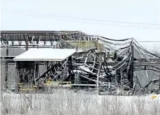  ?? DAVE JOHNSON/WELLAND TRIBUNE ?? Port Colborne Fire and Emergency Services firefighte­rs were called out to the Vinyl Works Canada site Thursday morning to extinguish hotspots on the remains of the company on Barber Drive at Ramey’s Bend.