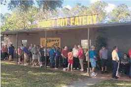  ?? PHOTOS BY STEPHEN HUDAK/STAFF ?? Snowbirds line up for “chicken night” at The Honey Pot, a cafeteria-style eatery near Clermont that serves all-you-can-eat chicken dinners for $10 a person on Tuesday nights.