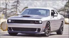  ?? Myung J. Chun Los Angeles Times ?? DODGE PAYS homage to big Detroit steel of the past with its Challenger Hellcat, which boasts 707 horsepower and 650 pound-feet of torque.