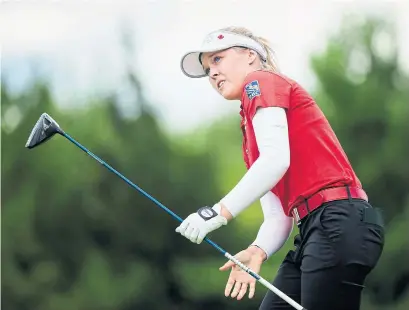  ?? NATHAN DENETTE THE CANADIAN PRESS ?? Brooke Henderson shot a bogey-free 3-under 69 on Friday, putting her at 9 under midway through the CP Women’s Open.