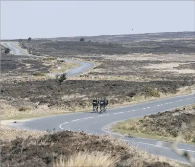  ?? PICTURE:BRUCE ROLLINSON ?? EXPOSED ROUTE: Cyclists make their way over Blakey Ridge, between Rosedale and Farndale, on the North York Moors.