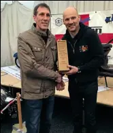  ??  ?? Darryl Bragh of Mercia SC collects the award from Ian Vanes-Jones (Burton Brewers SC) for Best Display with ‘Wigan Casino’.