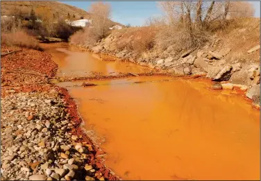  ?? (File Photo/AP/Montana Department of Environmen­tal Quality/Tom Henderson) ?? Work began in early October on a $26 million project to treat acid mine drainage from an old coal mine that is polluting Belt Creek in Belt, Mont.