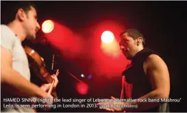  ?? (Shadi Bushra/Reuters) ?? HAMED SINNO (right), the lead singer of Lebanese alternativ­e rock band Mashrou’ Leila, is seen performing in London in 2013.