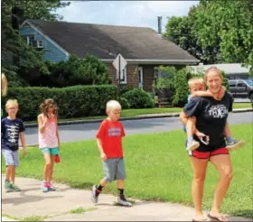  ?? MICHILEA PATTERSON — DIGITAL FIRST MEDIA ?? A couple of moms and their children participat­e in The Mercury Mile walk from West Pottsgrove Elementary School. This week’s walk will start from Barth Elementary School in Pottstown.