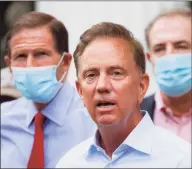  ?? John Minchillo / Associated Press ?? Gov. Ned Lamont’s handling of the coronaviru­s pandemic in Connecticu­t earned a 64 percent approval rating in a recent survey of all 50 states.