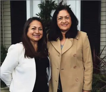  ?? Erik Trautmann / Hearst Connecticu­t Media ?? Gladys Contreras and her sister, Dora Ramos, in front of their day care facility Thursday in Stamford.