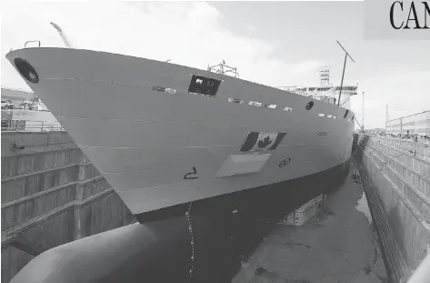  ?? JACQUES BOISSINOT / THE CANADIAN PRESS FILES ?? Royal Canadian Navy personnel will begin training on the Resolve-class naval support ship Asterix starting in January.