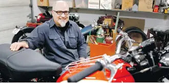  ?? JIM WELLS ?? Columnist Greg Williams and his friends restored a 1958 Triumph TR6B Trophy motorcycle that sits in the middle of his Calgary workshop.