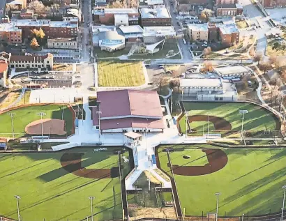  ?? JAMES MOORE ?? This view of the Kansas City Urban Youth Academy, showing its four outdoor fields and indoor practice facility, was taken from the north. Directly to the south of the indoor facility is the building containing the Negro Leagues Museum.