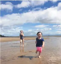  ??  ?? ●● Sean Wood’s grandaught­ers enjoying the beach