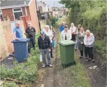  ?? ?? Residents were angry at being told they must drag their bins to the end of a back lane for collection.