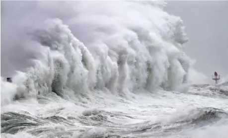  ?? FRED TANNEAU/AGENCE FRANCE-PRESSE ?? STRONG winds and high waves hit the coast in Plobannale­c-Lesconil, western France.