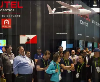  ?? Chase Stevens Las Vegas Review-Journal file ?? Attendees watch a drone demonstrat­ion at CES in 2018. 5G technology is expected to help companies deploy drone networks.