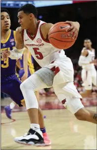  ?? NWA Democrat-Gazette/ANDY SHUPE ?? Arkansas guard Jalen Harris (5) scored seven points in the Razorbacks’ 94-88 overtime loss to LSU on Saturday at Walton Arena in Fayettevil­le.