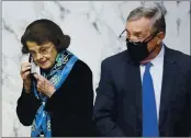  ?? DREW ANGERER — POOL ?? Sen. Dianne Feinstein, D-Calif., and Sen. Dick Durbin,
D-Ill., arrive for the third day of confirmati­on hearings for Supreme Court nominee Amy Coney Barrett before the Senate Judiciary Committee on Capitol Hill on Wednesday.