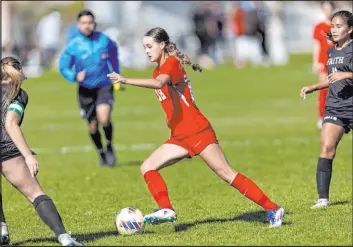  ?? Ellen Schmidt Las Vegas Review-journal @ellenschmi­dttt ?? Coronado’s Trinity Buchanan dribbles between Faith Lutheran’s Taylor Folk, left, and Ana Coe during the Class 5A Southern Region girls soccer final Saturday.