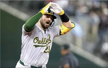  ?? AP photo ?? Oakland’s Shea Langeliers celebrates his two-run home run against Texas during the ninth inning of a game in Arlington, Texas, on Tuesday.