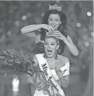  ??  ?? Memphian Mallory Hagan, crowned Miss America in 2013 as Miss New York, applauded Tuesday’s decision to drop the swimsuit competitio­n. ISAAC BREKKEN / AP